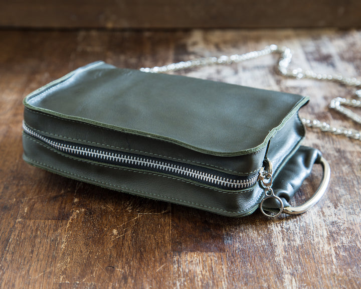 Green leather cross body clutch zipper look