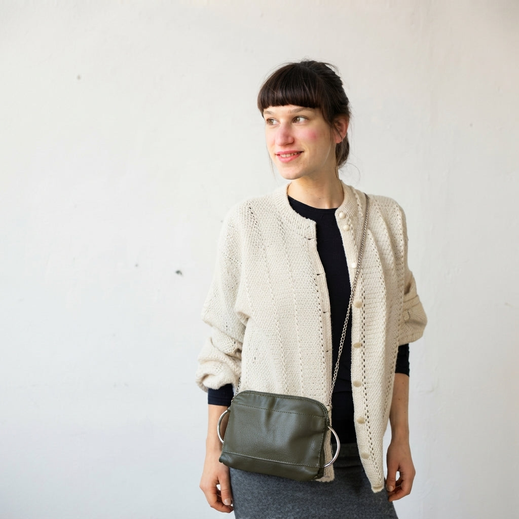 woman_full_body_wearing_a_cross-body_green_clutch
