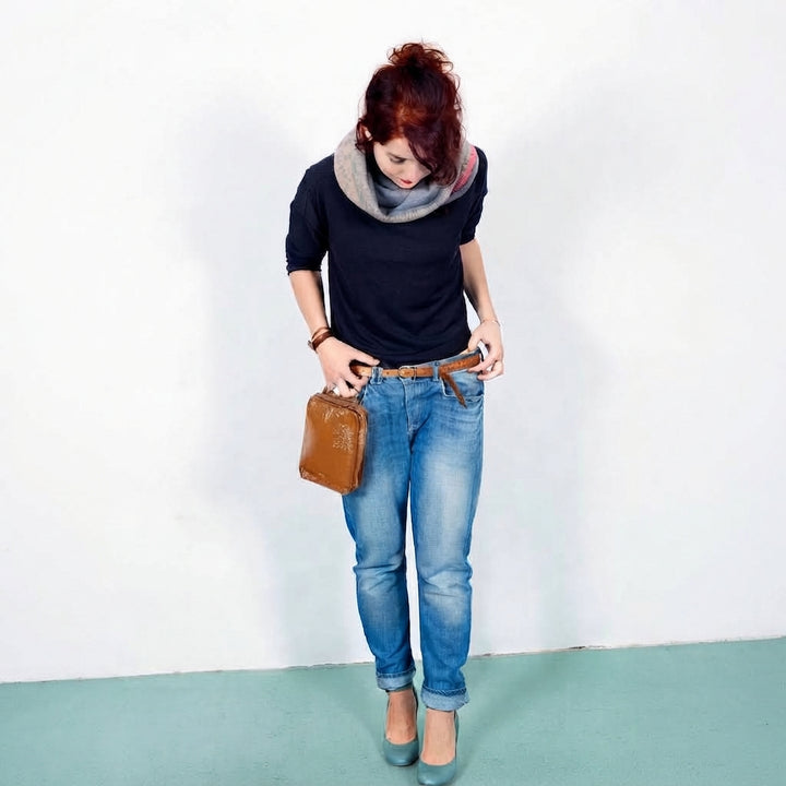 woman_standing_full_body_holding_shiny_brown_clutch2