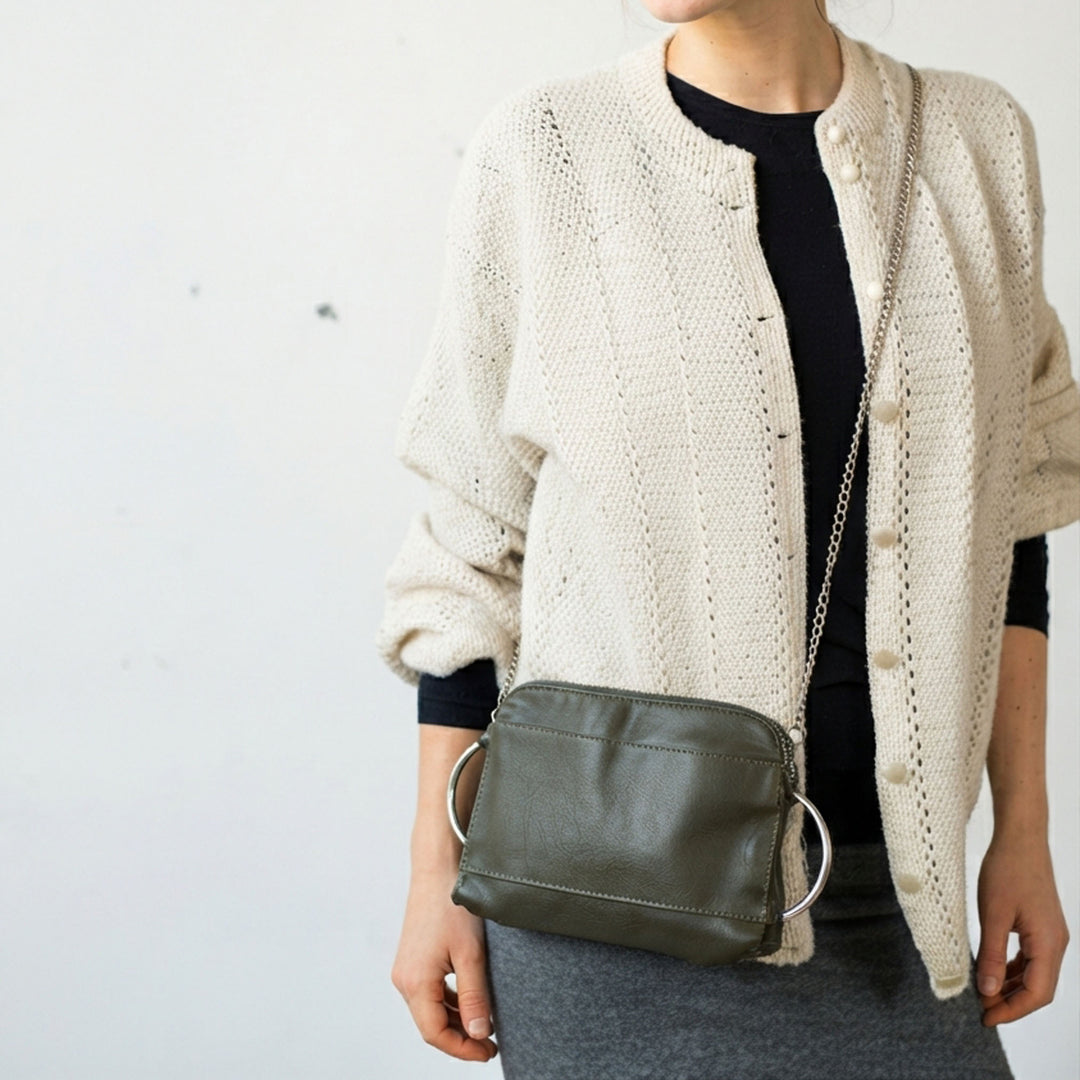woman_wearing_a_cross-body_green_clutch