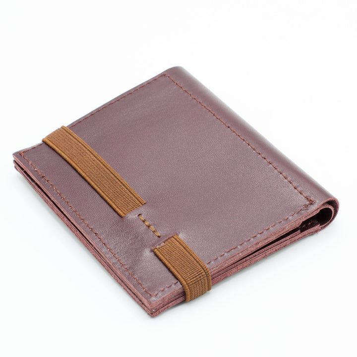 Zippers | Burgundy leather wallet | Brown rubber band