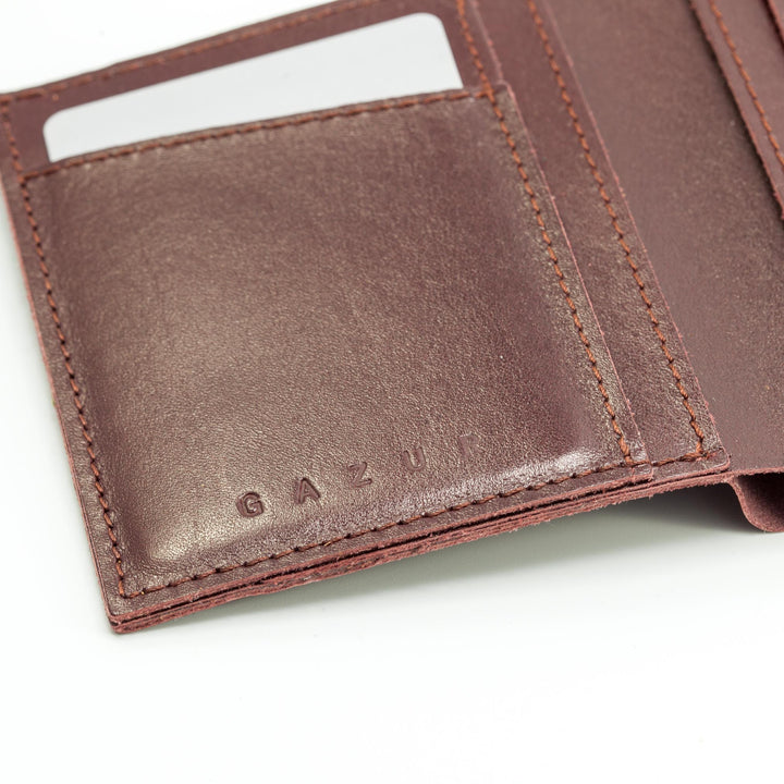 Zippers | Burgundy leather wallet | Brown rubber band